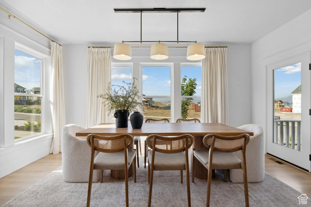 Dining space with wood finished floors