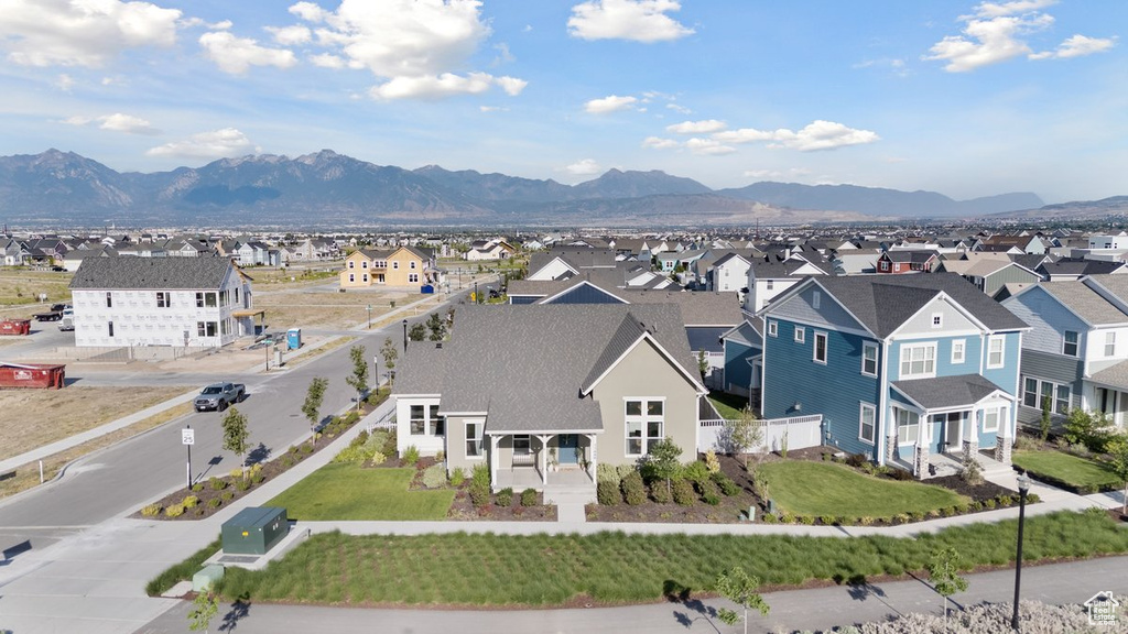 Aerial view of residential area featuring a mountain backdrop