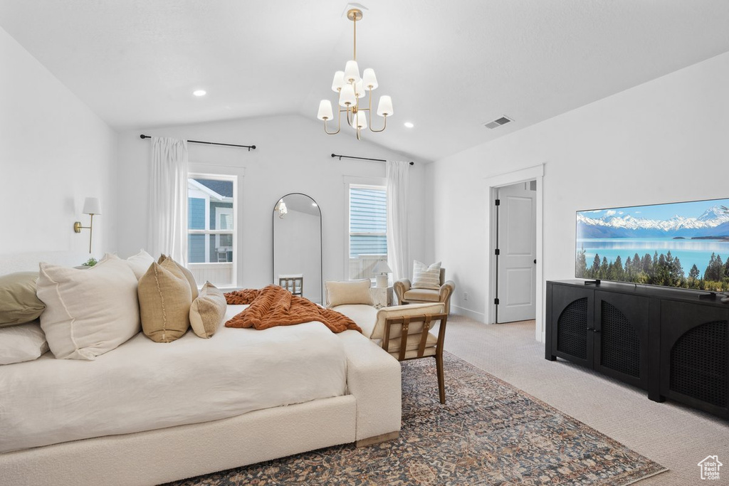 Carpeted bedroom featuring a chandelier, vaulted ceiling, and recessed lighting