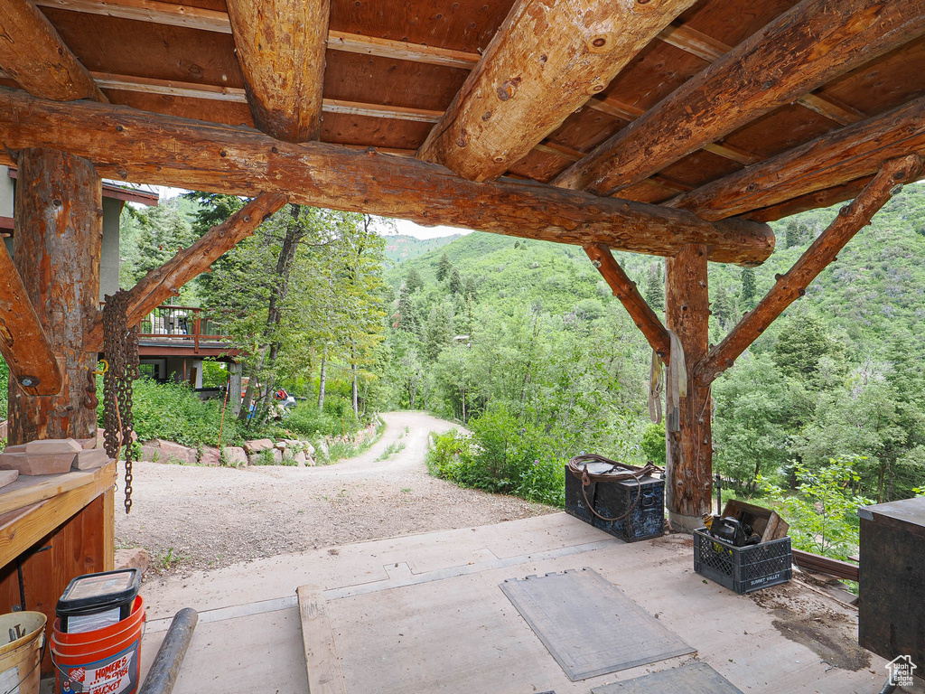 View of patio featuring a wooded view