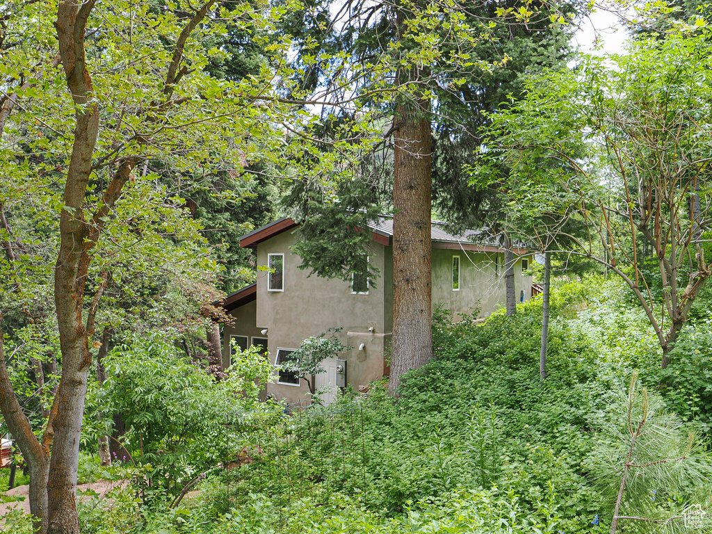 View of property exterior with stucco siding