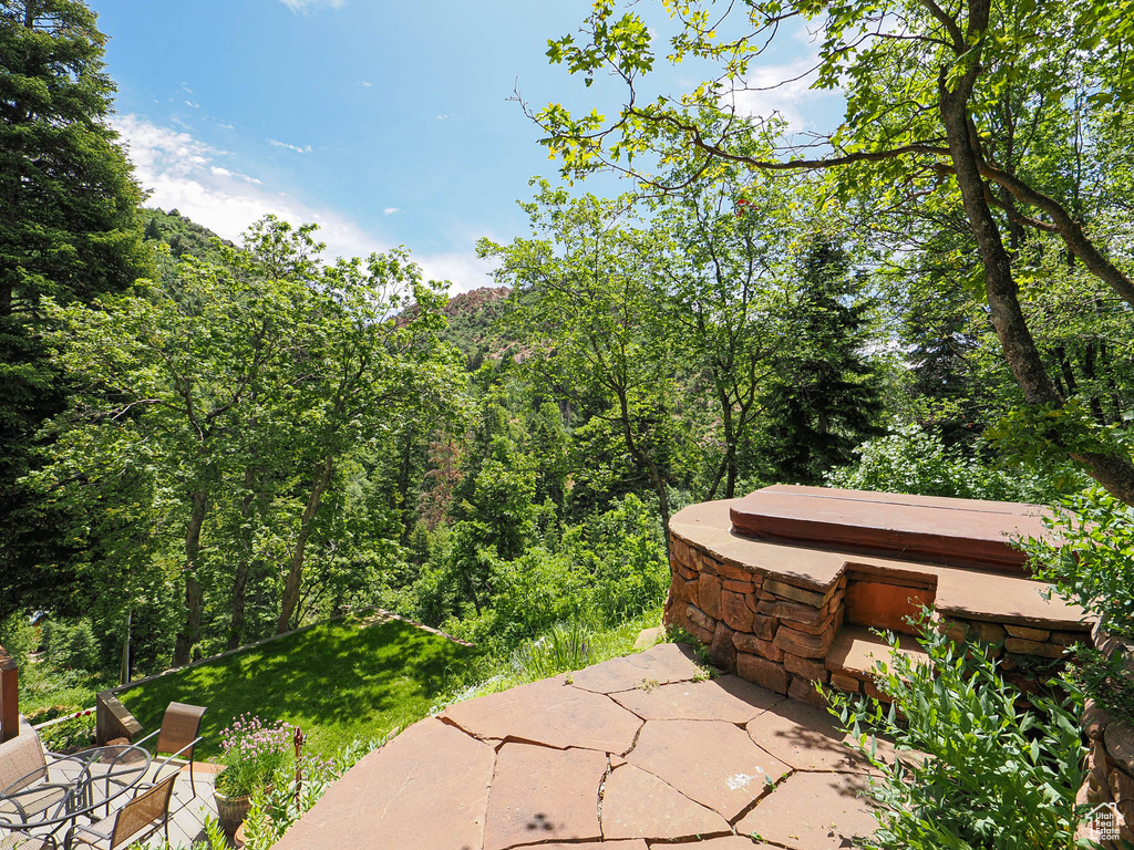 View of patio / terrace with a forest view
