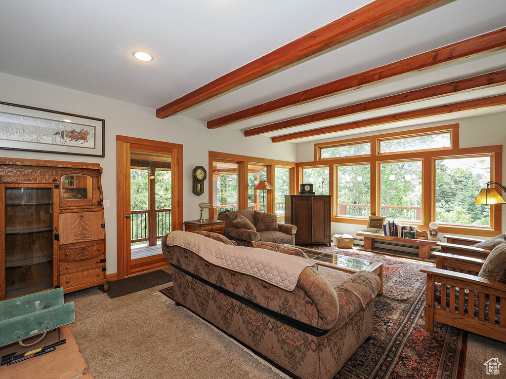 Living area featuring recessed lighting and beamed ceiling