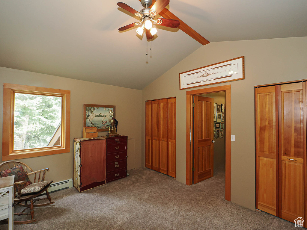 Sitting room featuring ceiling fan, carpet flooring, and baseboard heating