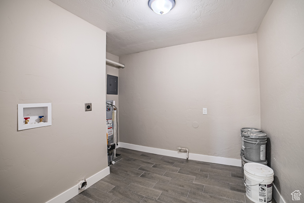 Washroom featuring hookup for an electric dryer, washer hookup, wood tiled floors, and electric panel