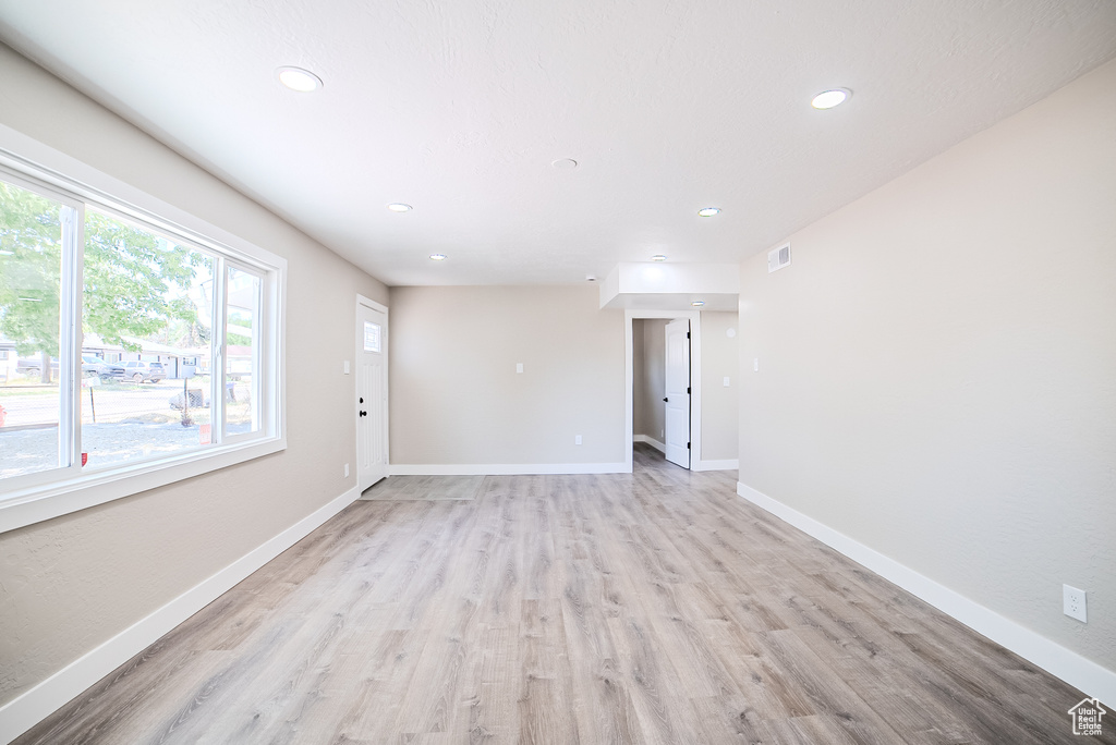 Empty room with recessed lighting and light wood finished floors