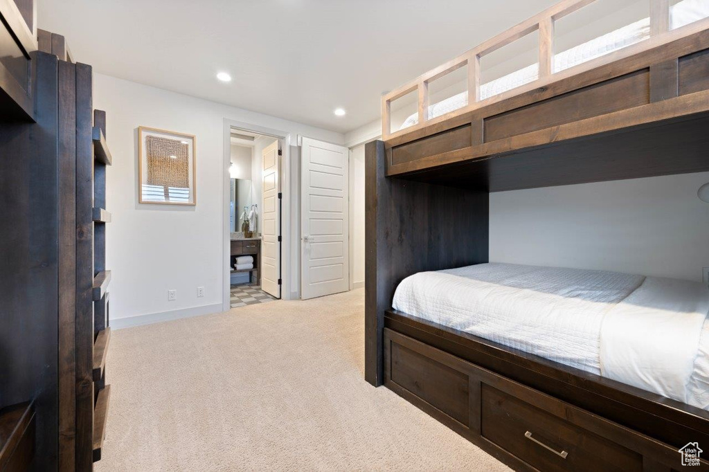 Bedroom featuring light carpet and recessed lighting