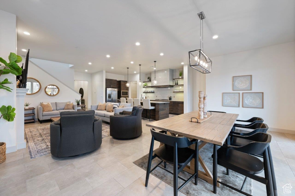 Dining room with recessed lighting and light tile patterned flooring