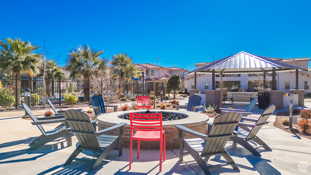 View of patio featuring a gazebo and a fire pit