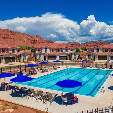 Community pool featuring a mountain view and a patio area