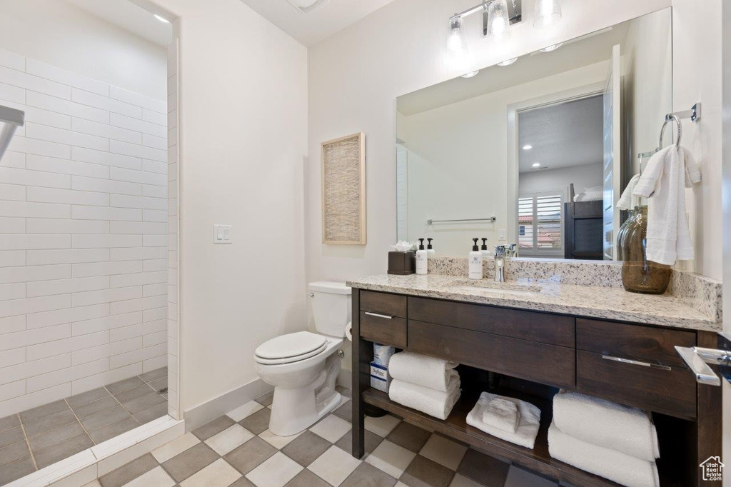 Full bath with vanity and a walk in shower
