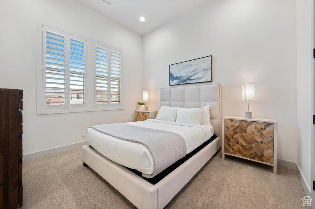 Carpeted bedroom featuring baseboards and recessed lighting