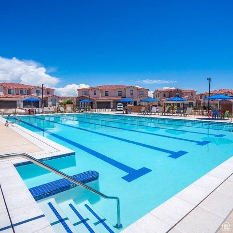 Community pool with a patio