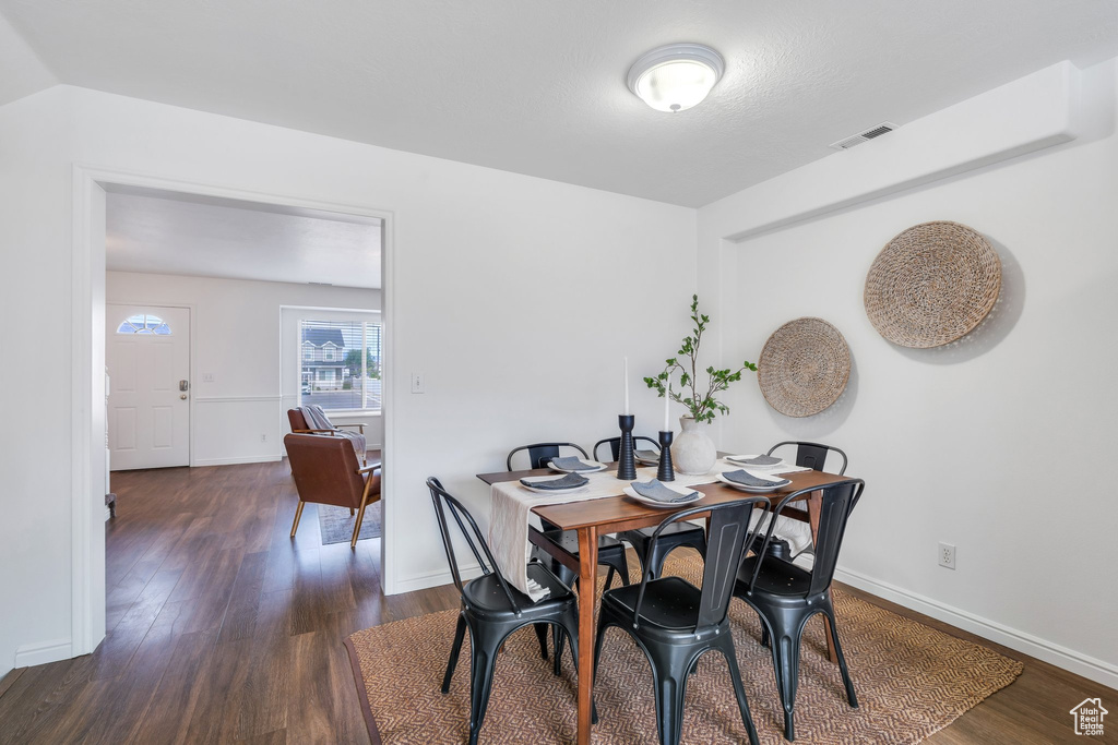 Dining space with wood finished floors