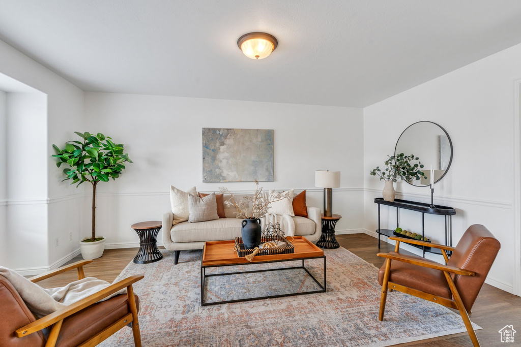 Living area featuring wood finished floors and baseboards