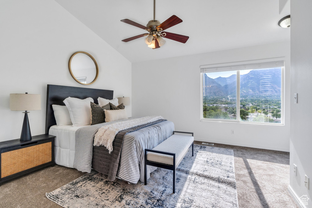 Bedroom featuring lofted ceiling, carpet floors, and a ceiling fan