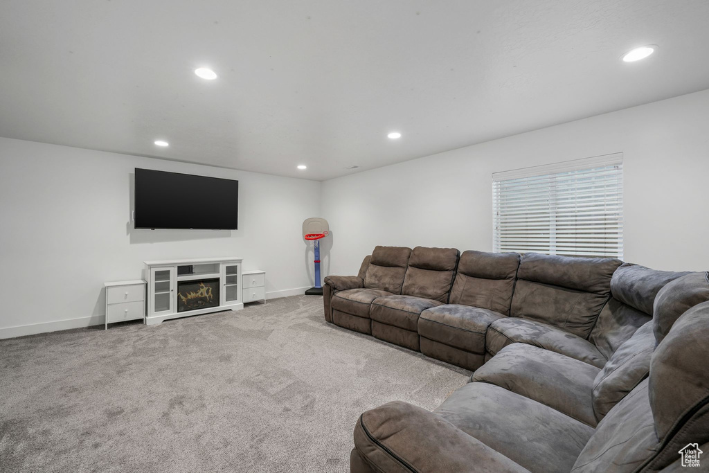 Living room with recessed lighting and carpet flooring