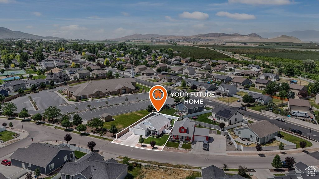 Aerial view of residential area with a mountain backdrop
