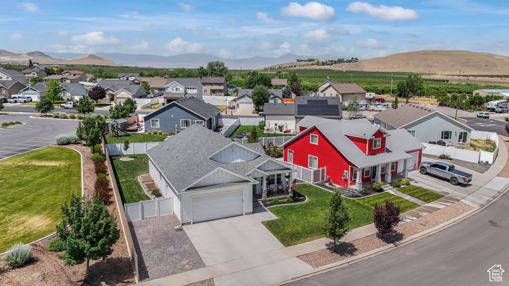 Aerial view of residential area featuring a mountain backdrop