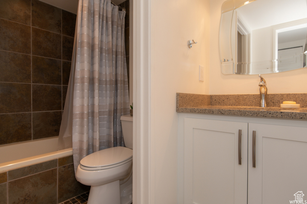 Full bathroom with vanity and tiled shower / bath combo