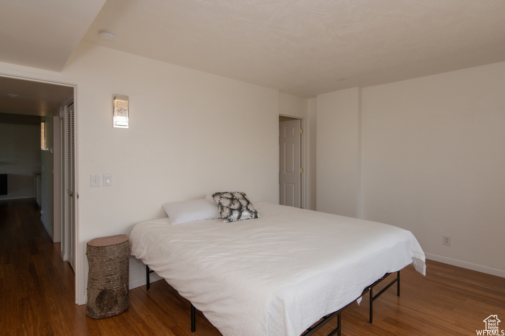 Bedroom featuring wood finished floors