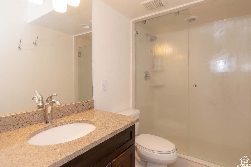 Bathroom with vanity and a shower stall