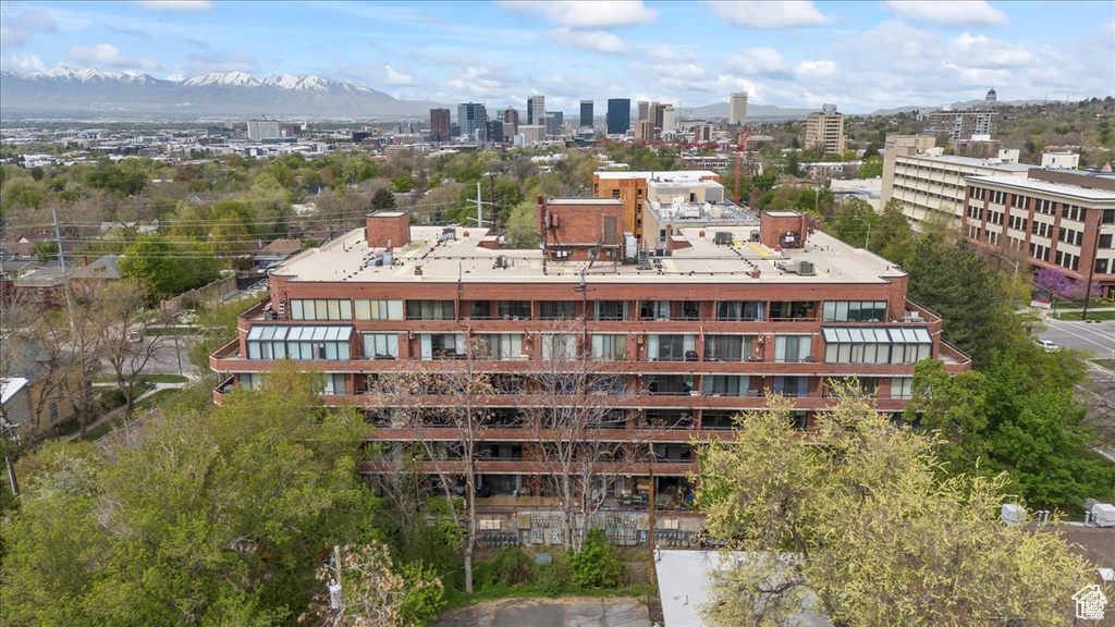 View of property with a mountain view and a city view