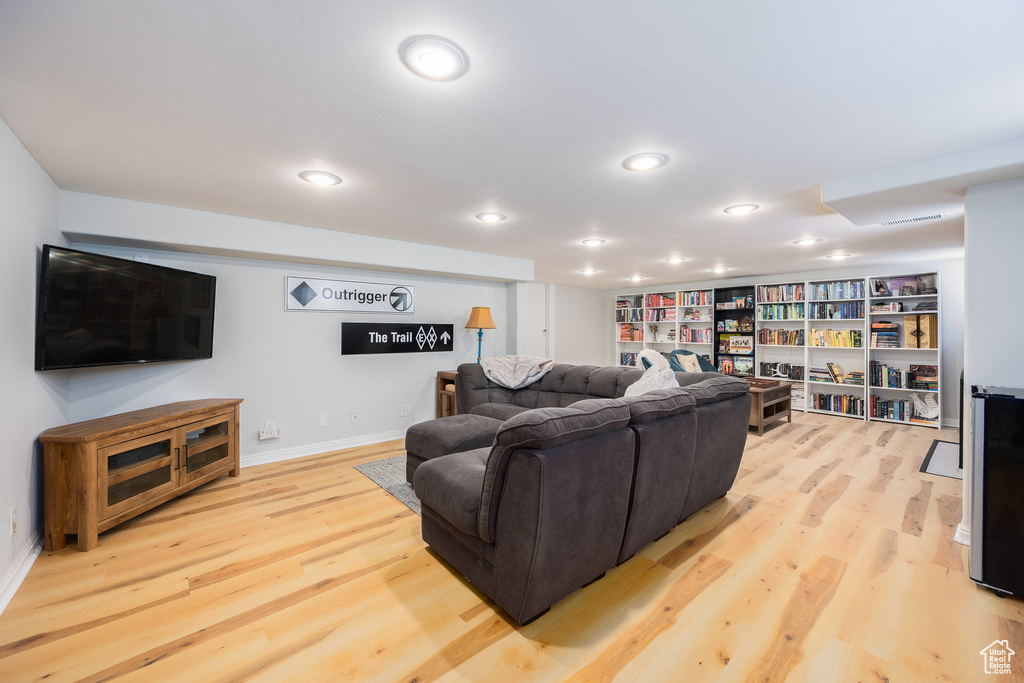 Living room featuring light wood finished floors and recessed lighting