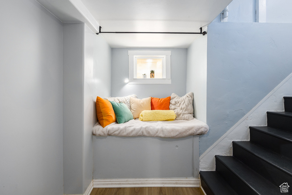 Stairs featuring wood finished floors