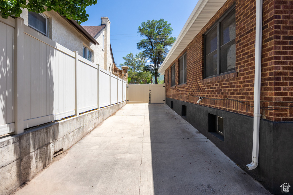 View of property exterior featuring brick siding