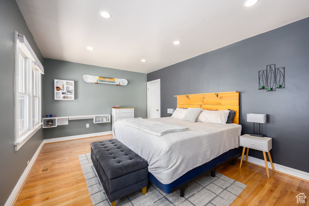 Bedroom featuring wood finished floors and recessed lighting