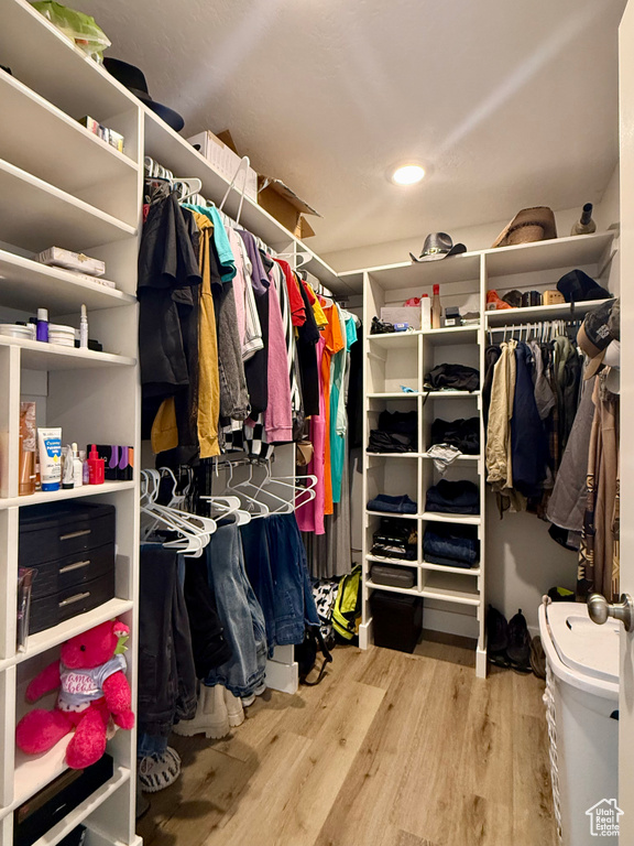 Walk in closet featuring wood finished floors