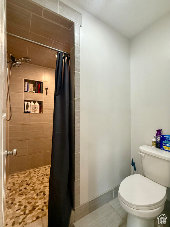Bathroom featuring a stall shower and tile patterned floors