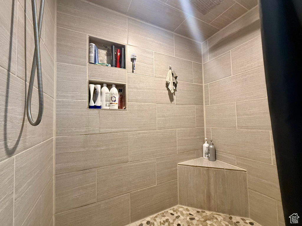 Full bathroom with a tile shower