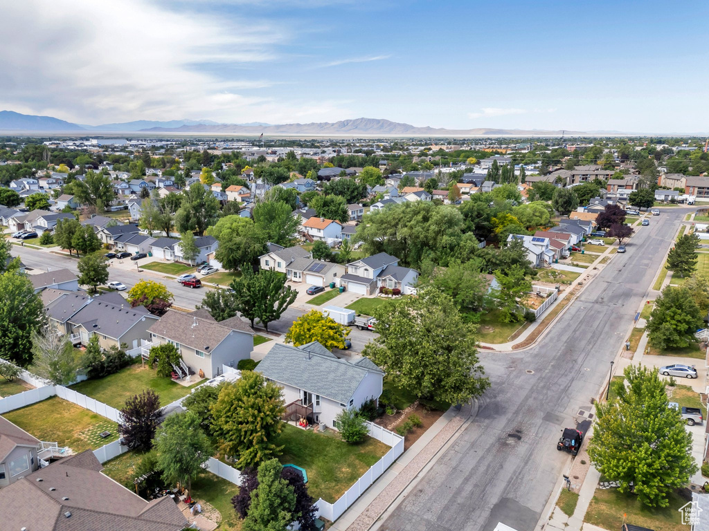 Aerial perspective of suburban area with a mountain backdrop