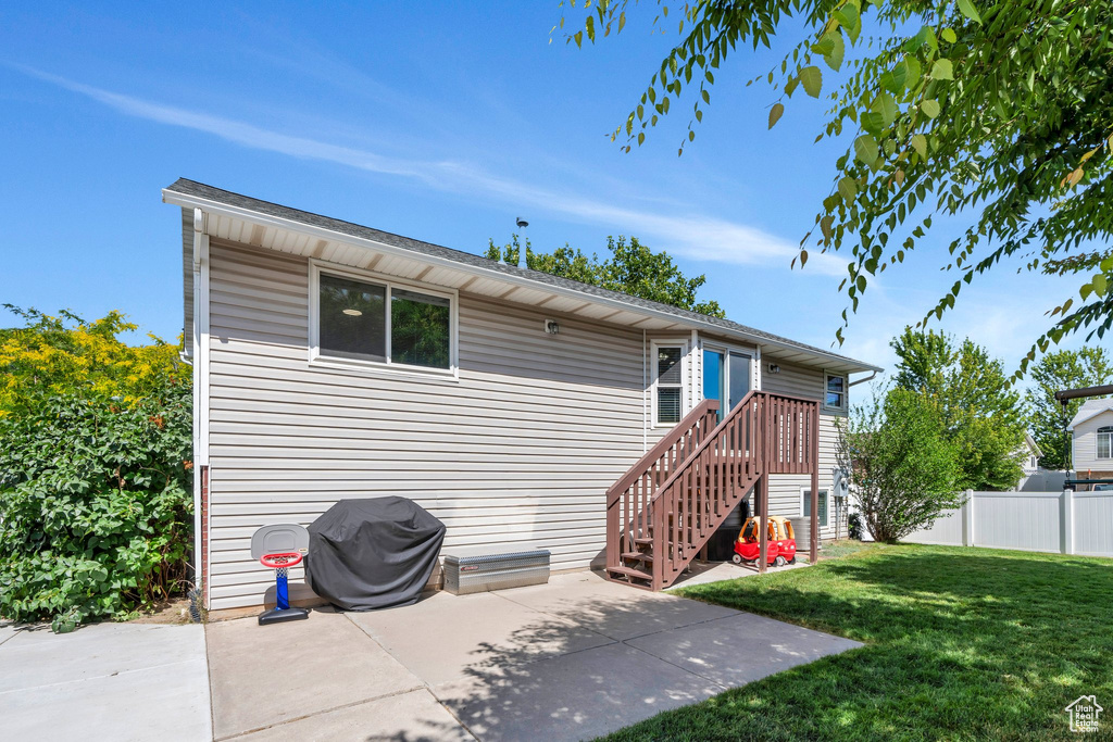 Rear view of house with a patio area