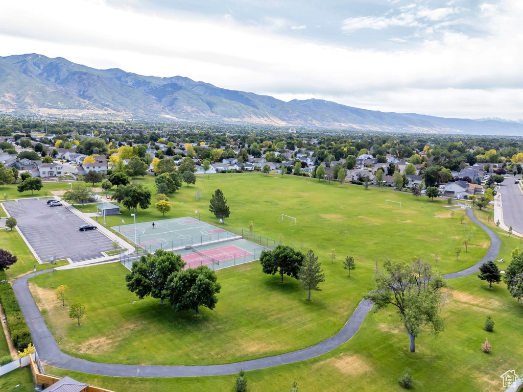 Aerial perspective of suburban area with a mountain backdrop