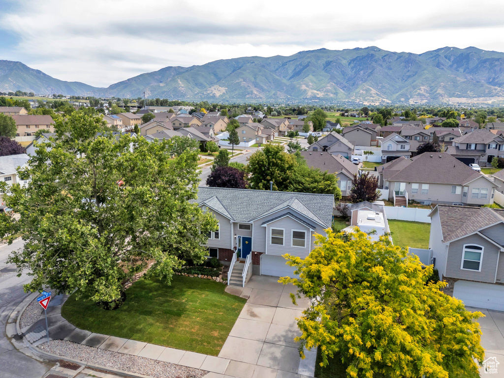 View of mountain backdrop featuring nearby suburban area