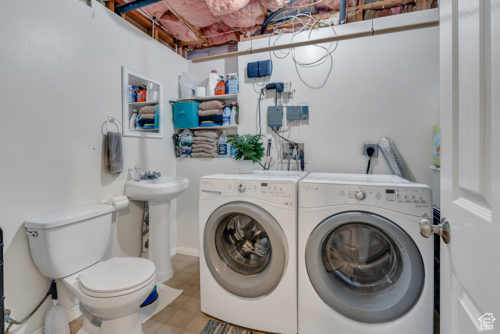 Washroom featuring separate washer and dryer