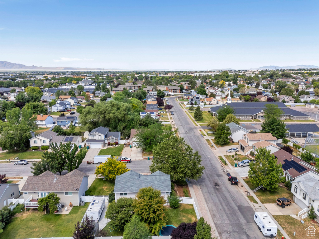 Aerial view of residential area featuring mountains