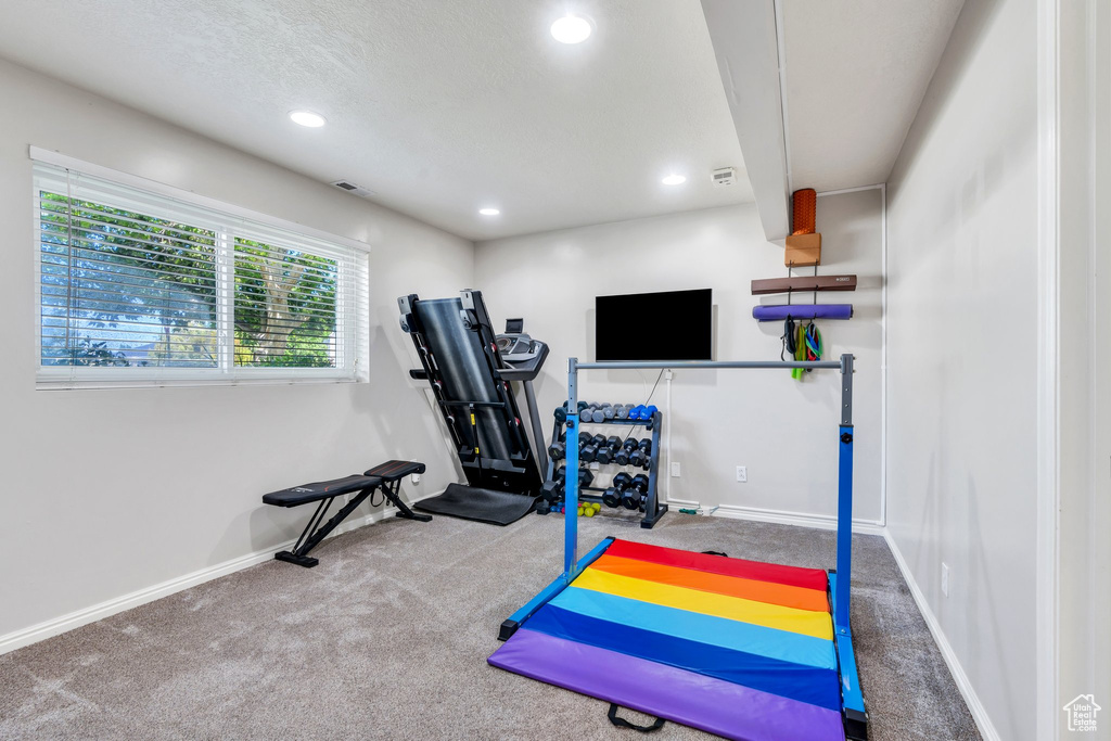 Workout room featuring carpet and recessed lighting