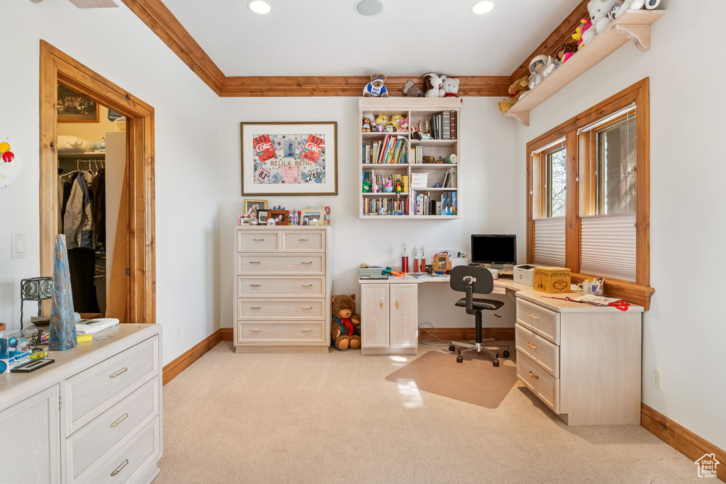 Office area featuring light colored carpet, recessed lighting, and built in study area