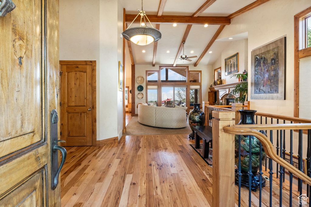 Foyer entrance with high vaulted ceiling, beamed ceiling, light wood-type flooring, recessed lighting, and ceiling fan