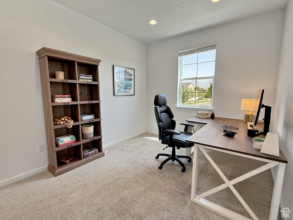 Office area with carpet flooring, recessed lighting, and a textured ceiling