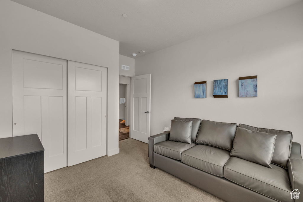 Living area with carpet flooring