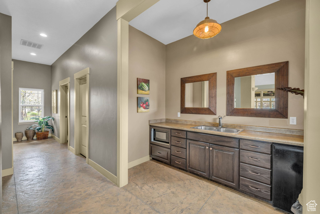Bathroom with vanity and recessed lighting