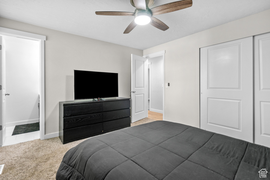 Bedroom featuring a closet, carpet flooring, and ceiling fan