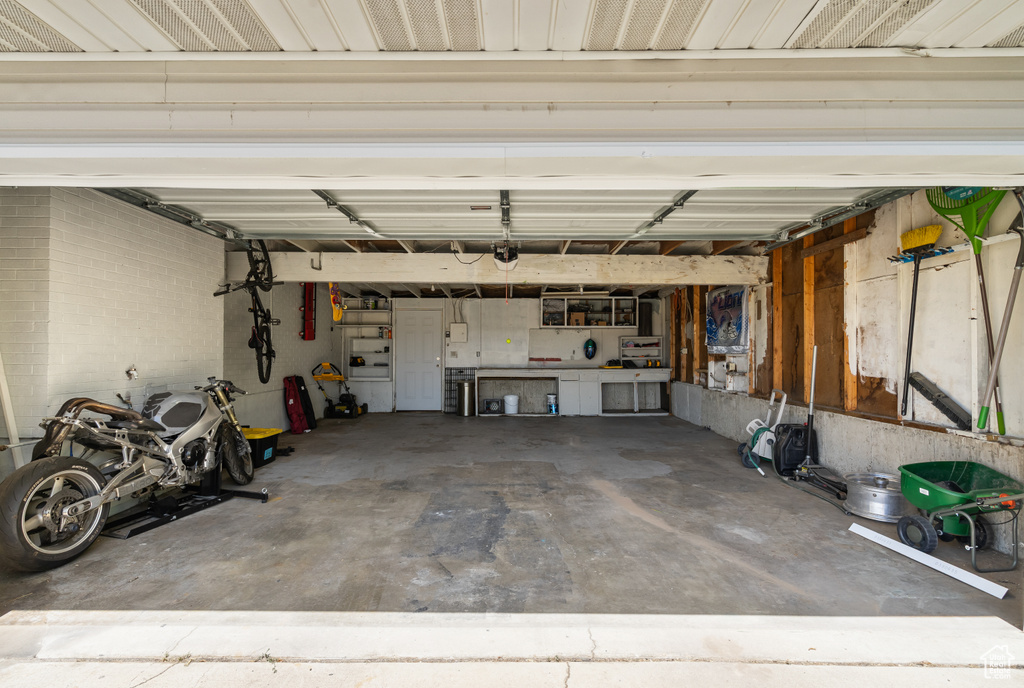 Garage featuring a garage door opener