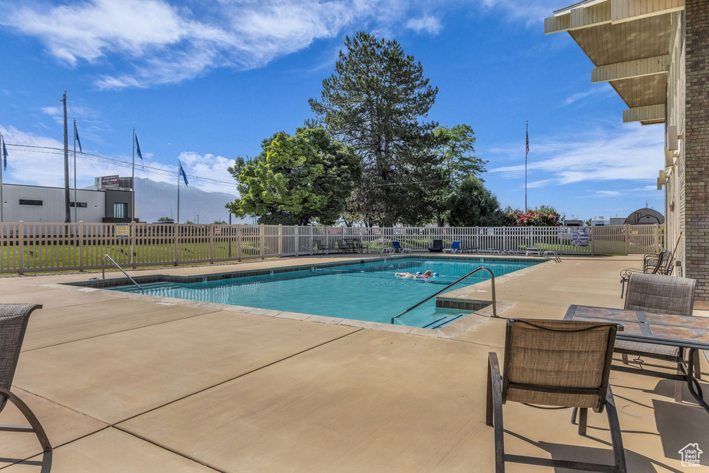 Community pool with a patio area