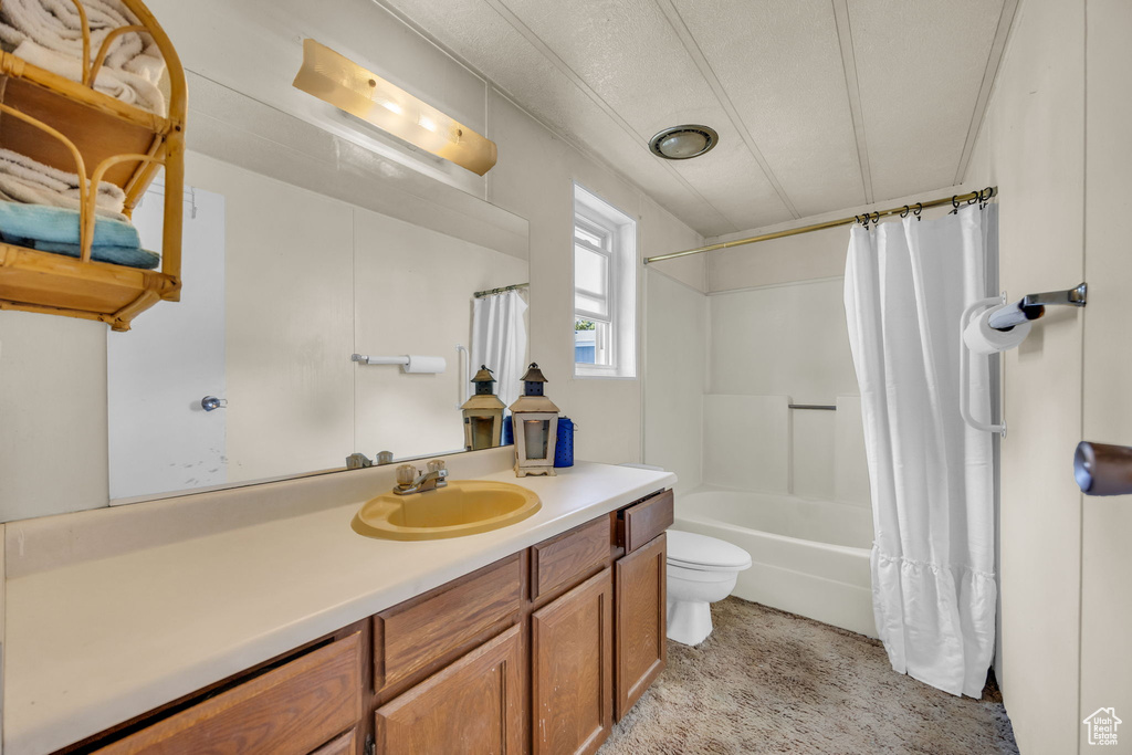 Bathroom with vanity and shower / bathtub combination with curtain